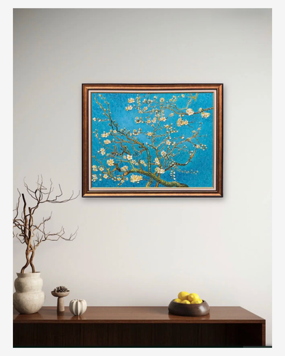 Almond Blossoms wall art displayedabove a modern wooden entrywayconsoletable