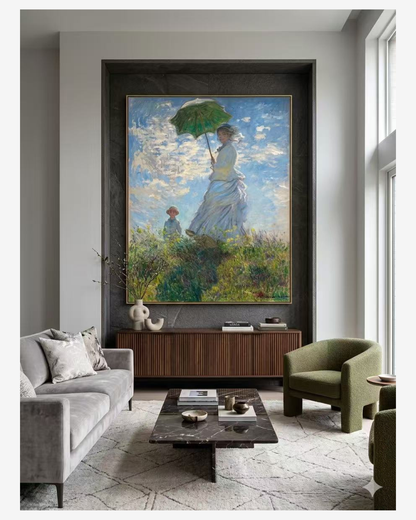 LargeMonet reproduction canvas art on adark stone accent wall in a luxuryliving room